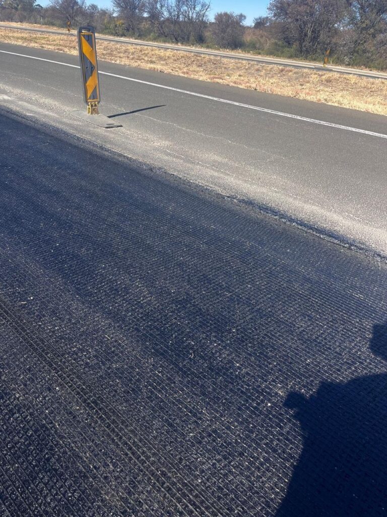 Glass fibre reinforcing grid prevents cracking and extends life of pavements and highways